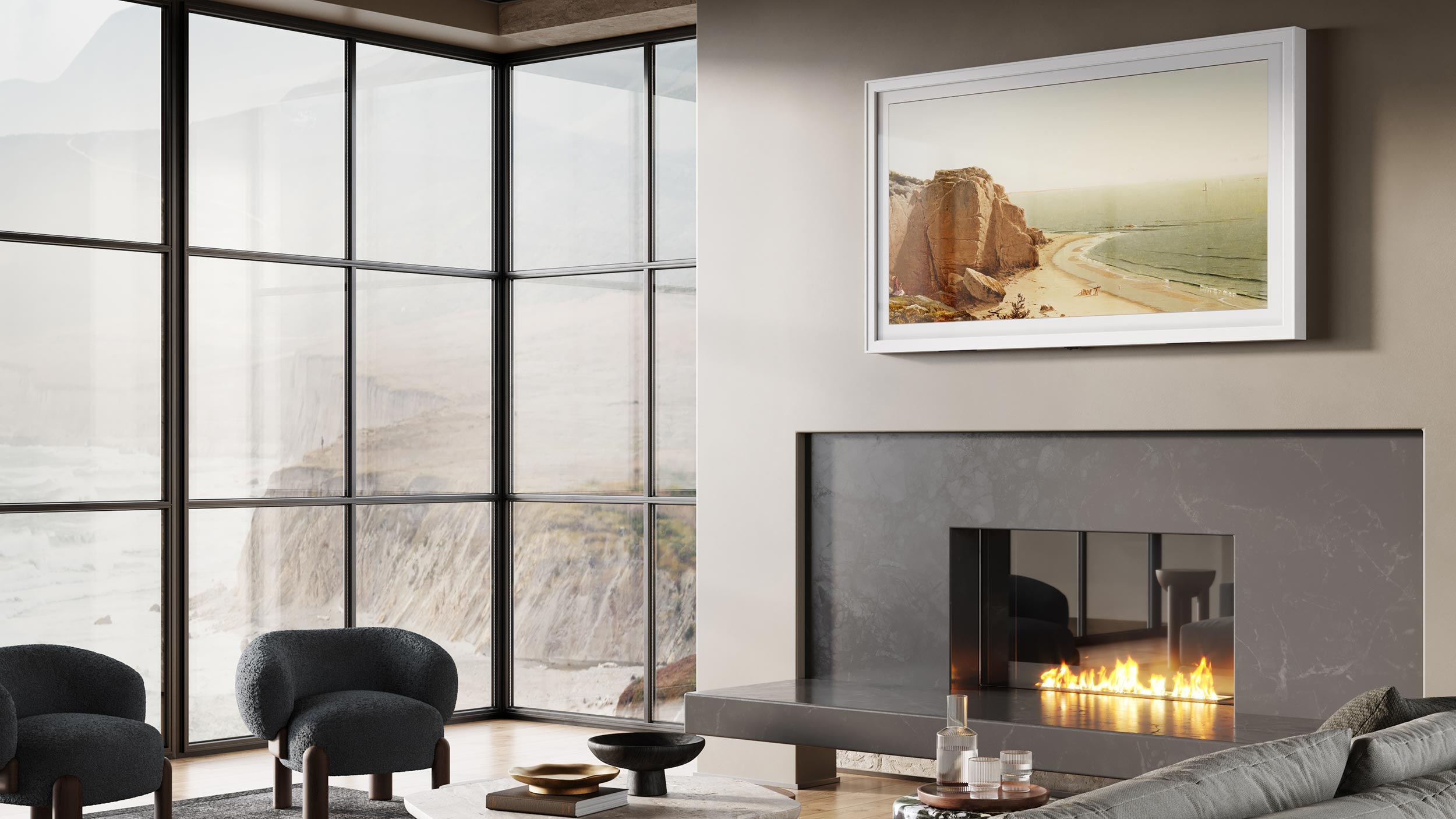 Close-up of a modern fireplace with a frame TV showing a coastal landscape
