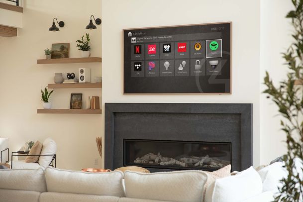 Control4 interface on a TV in a warm and modern home
