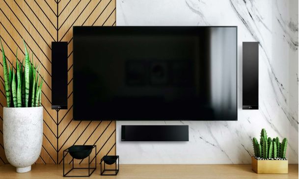 TV with three soundbars surrounding it