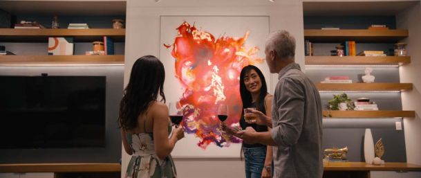 Group of people in a gallery setting with wine